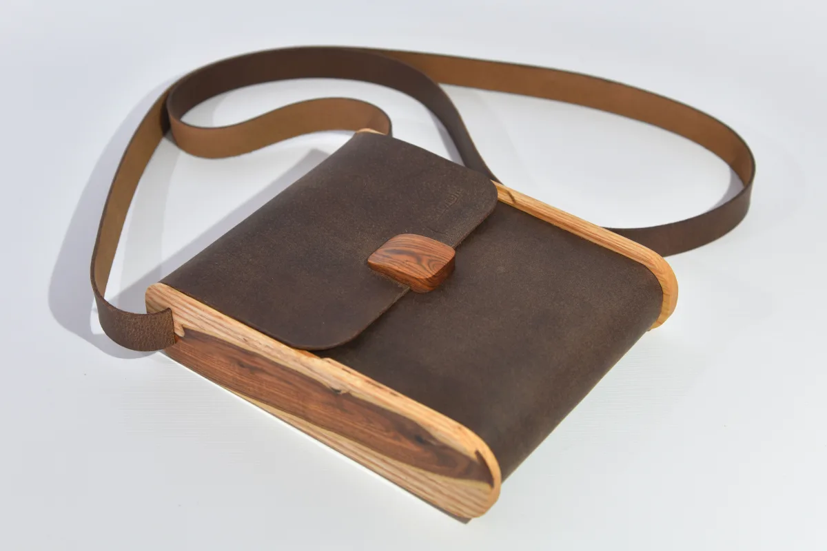 Bernd XS from smoothed, antique water buffalo full-grain leather in dark brwon with elaborate inlays and closure in Gorse wood from La Palma and ash wood
