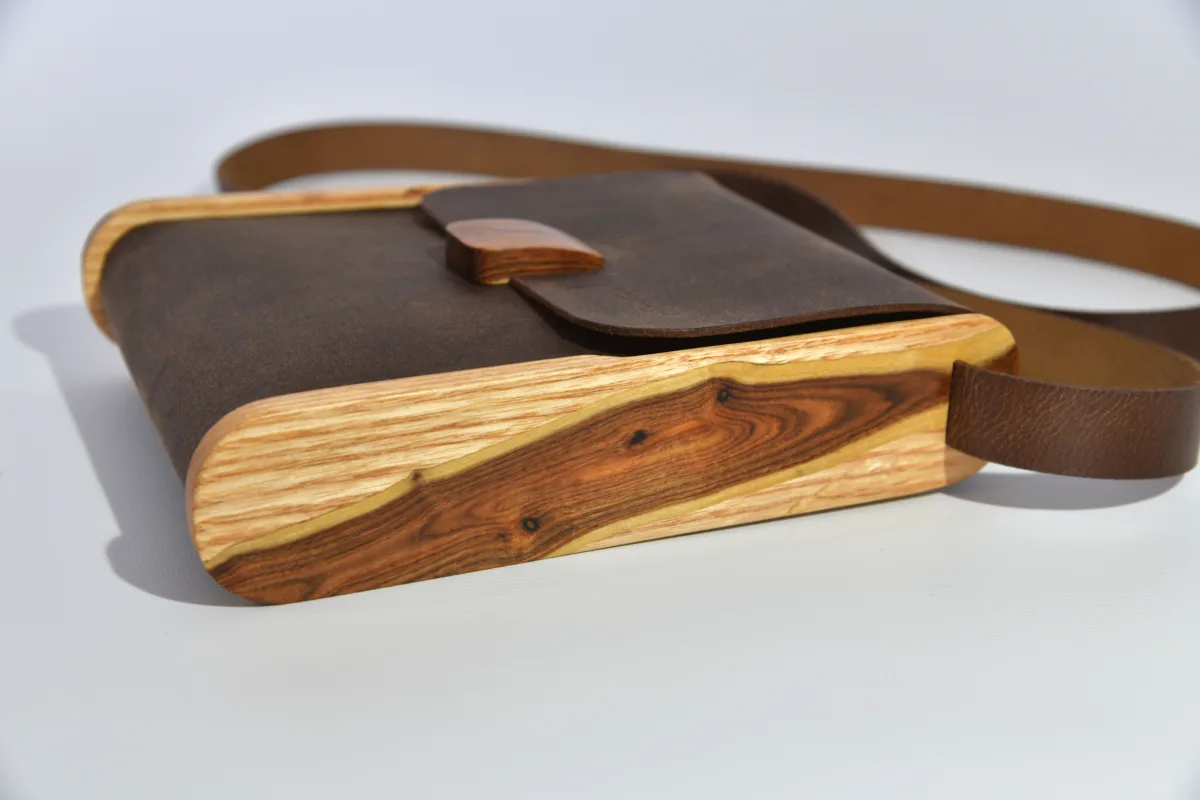 Bernd XS from smoothed, antique water buffalo full-grain leather in dark brwon with elaborate inlays and closure in Gorse wood from La Palma and ash wood