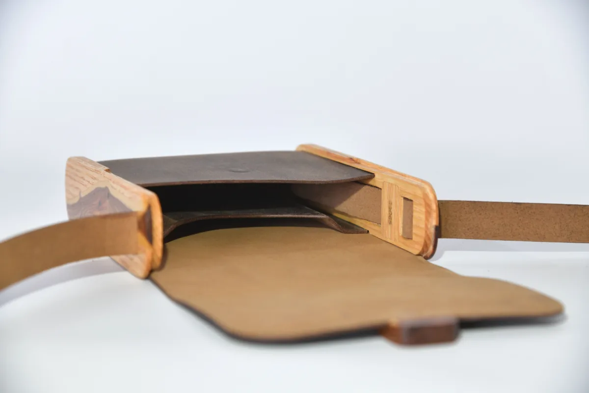 Bernd XS from smoothed, antique water buffalo full-grain leather in dark brwon with elaborate inlays and closure in Gorse wood from La Palma and ash wood