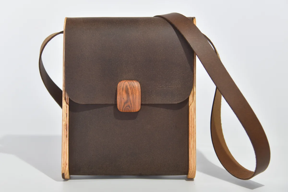 Bernd XS from smoothed, antique water buffalo full-grain leather in dark brwon with elaborate inlays and closure in Gorse wood from La Palma and ash wood